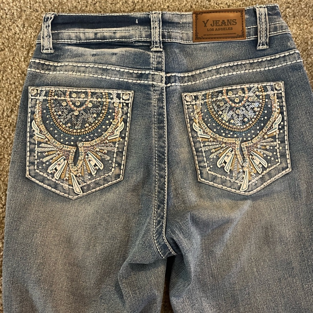 Embellished Blue Jeans with Intricate Pocket Design